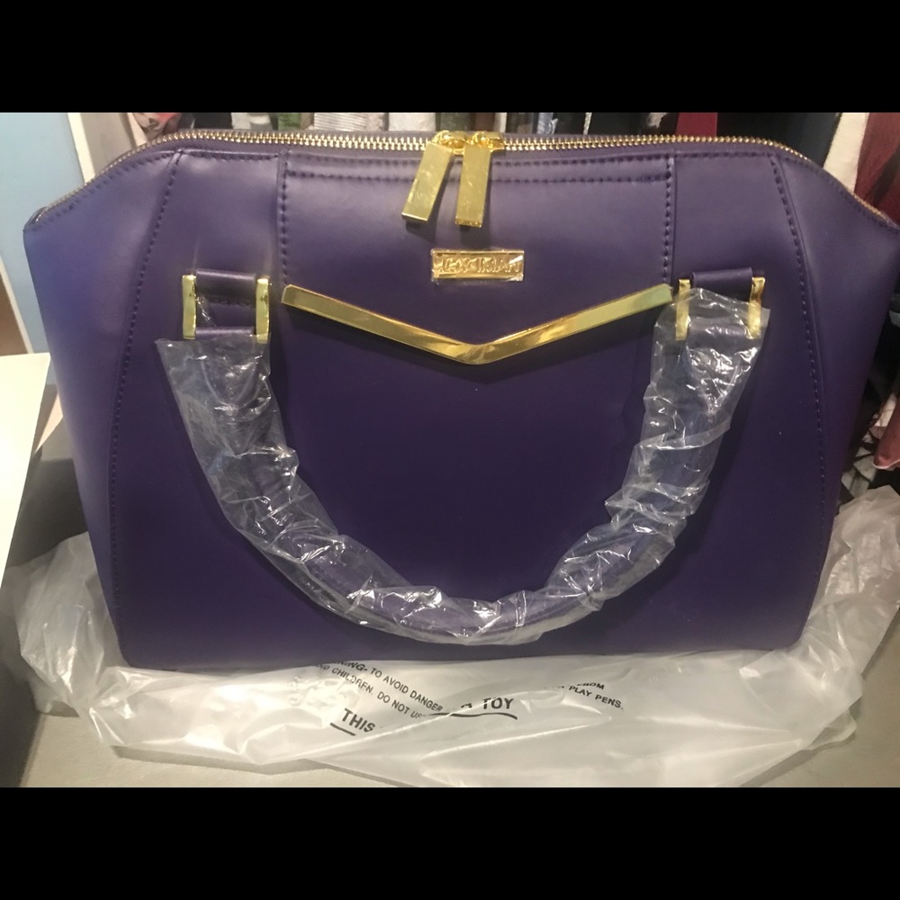 Joy+ Iman purple large bag... with crossbody new.